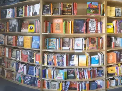 A photo showing a large bookcase full of books.