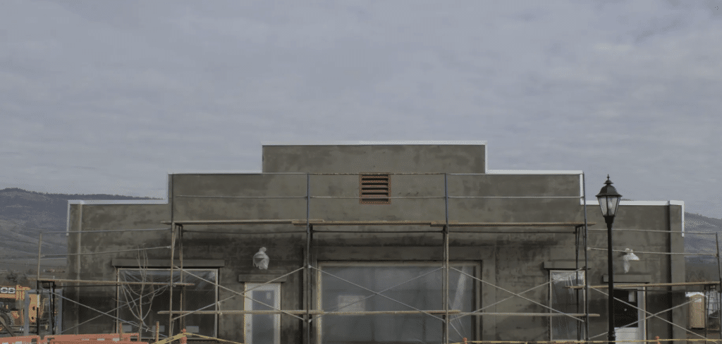 A photograph of a concrete building in a large open outdoor space